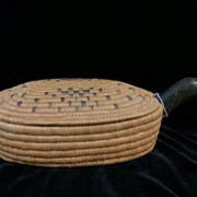 Cover image of Lidded Oval Basket with Stone Bird Handle.